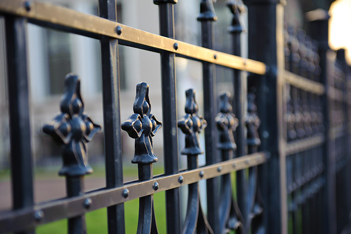 close up of wrought iron fence